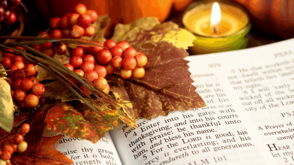 Open Bible with Psalm 101, autumn decor, and candle, symbolizing Christian faith and fall holidays.