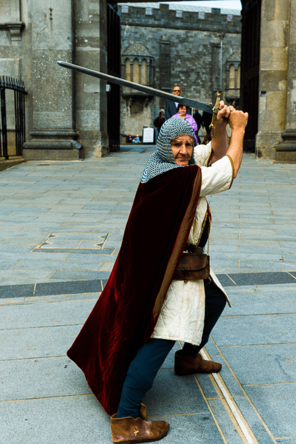 A man dressed in the armor of God stands poised to defend the faith with his sword of righteousness ready to take a swipe at any attacker